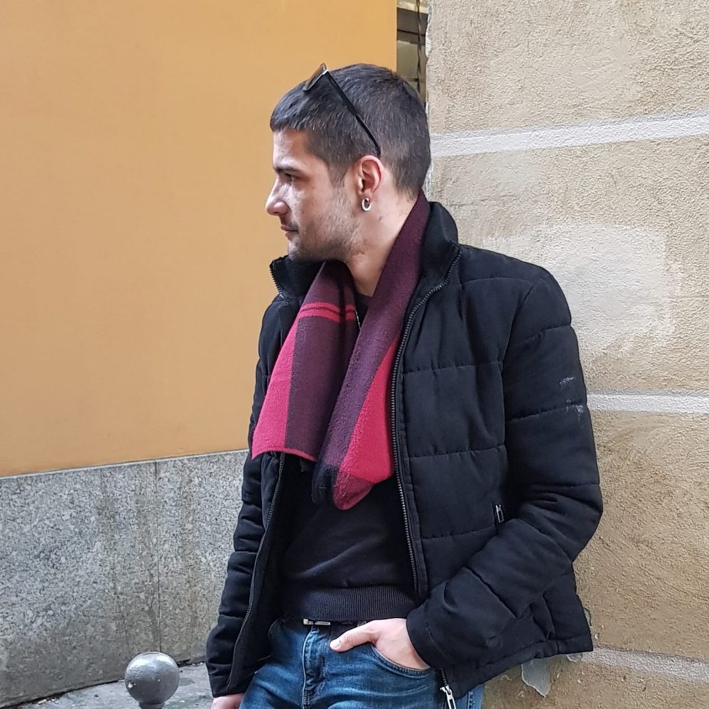 Photo of Damyan Momchev, leaning on a wall